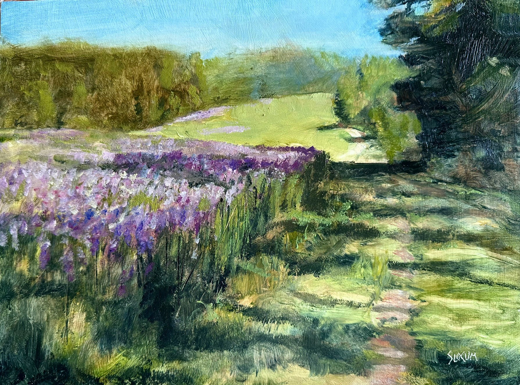 Landscape with lavender flowers, green grass, trees, and a blue sky, painted in an impressionistic style.