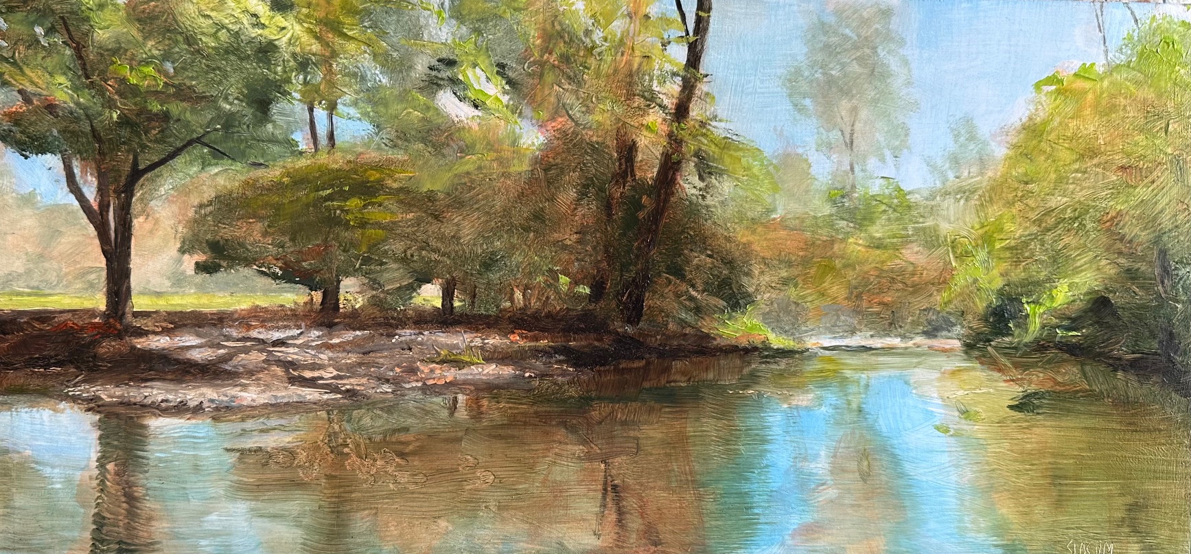 A peaceful river scene with trees and reflections on the water, in a natural landscape.