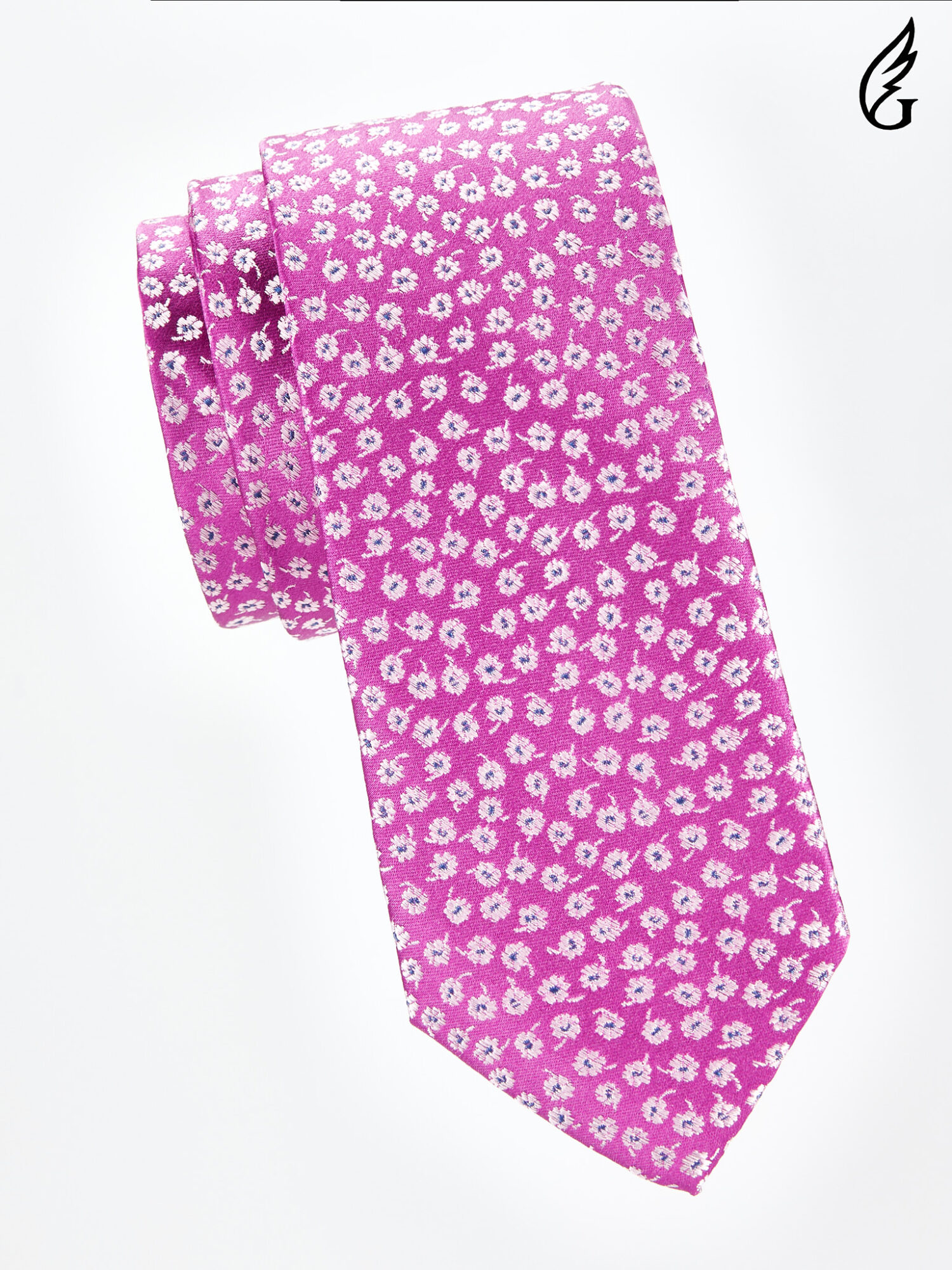 Pink tie with small white floral pattern, folded and placed on a white background.