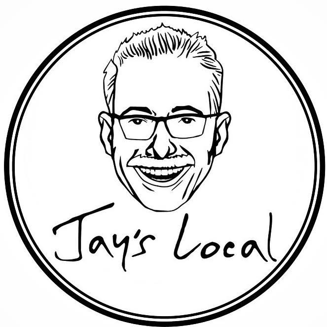 A black and white logo with a smiling man's face wearing glasses, and the text