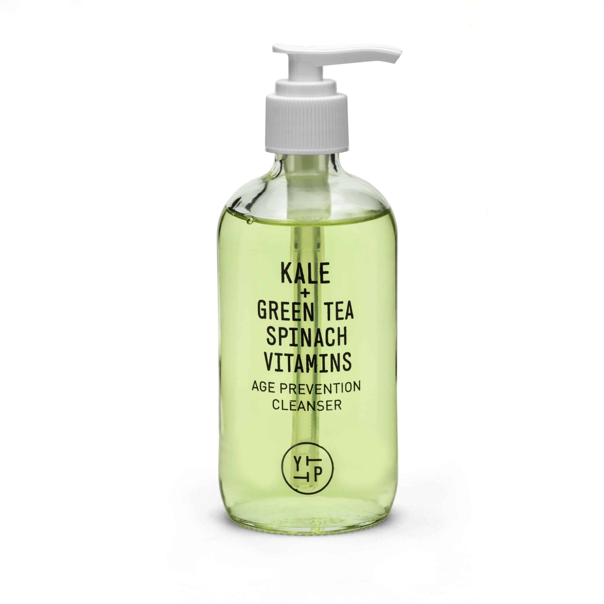 Clear pump bottle with green liquid labeled as kale, green tea, spinach, vitamins, age prevention cleanser, with a pump top.