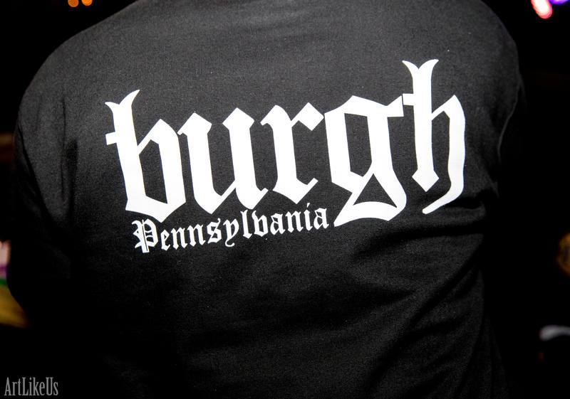 Black shirt with white text reading 'hugh Pennsylvania' in gothic font.